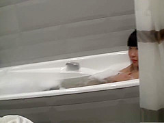 Sweet brunette is sucking dick in the bath tub